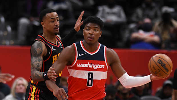 Atlanta Hawks forward John Collins guards Washington Wizards forward Rui Hachimura.
